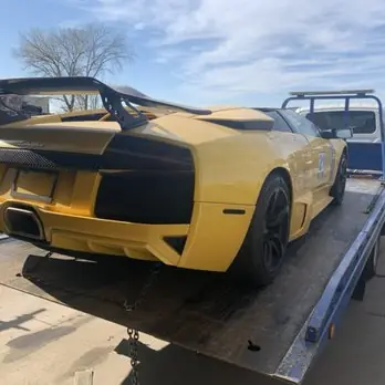 Yellow Lamborghini on a flatbed
