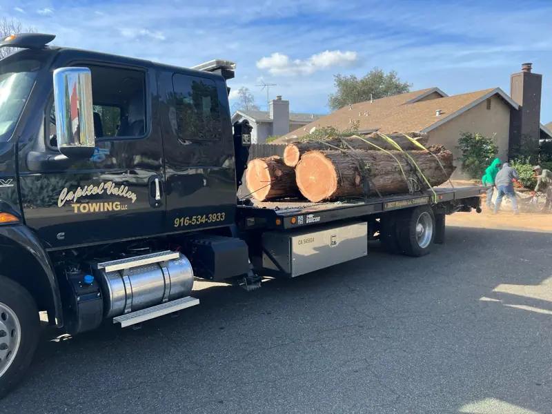 Flatbed hauling large logs