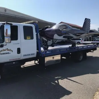 Motorcycle loaded on a flatbed tow truck